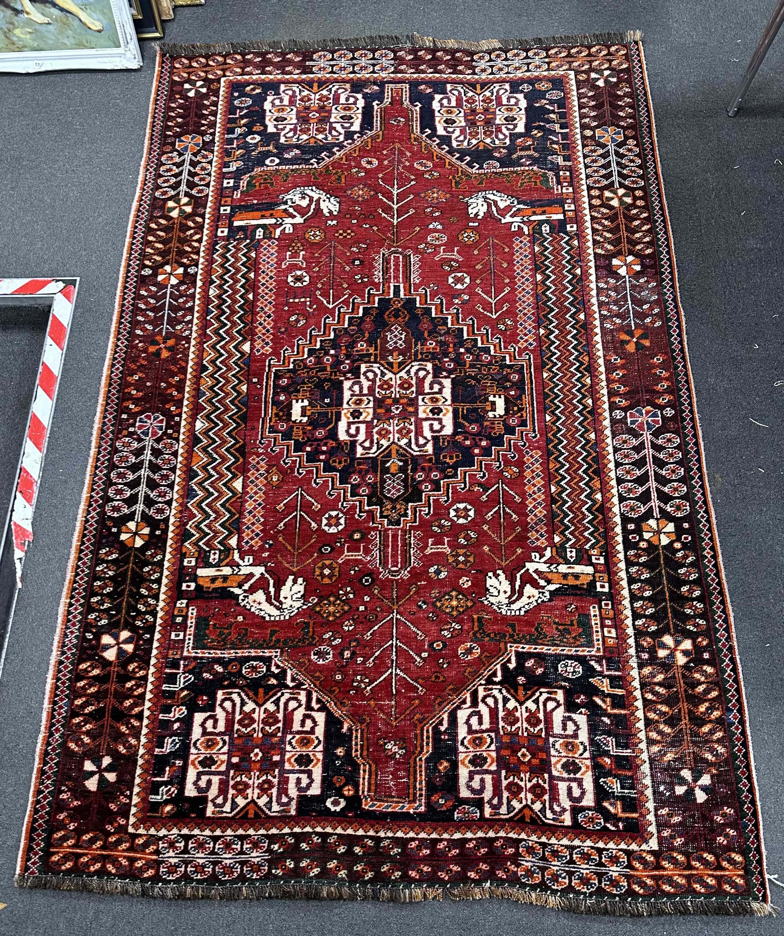 A Hamadan red ground rug, 234 x 148cm